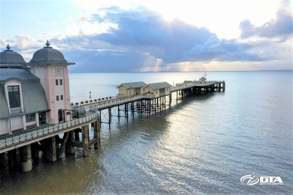 Aerial drone photograph of Penarth Pier at dawn