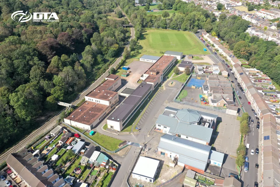 Aerial drone photograph of Coleg y Cymoedd campus in Tonypandy, Rhondda Cynon Taff
