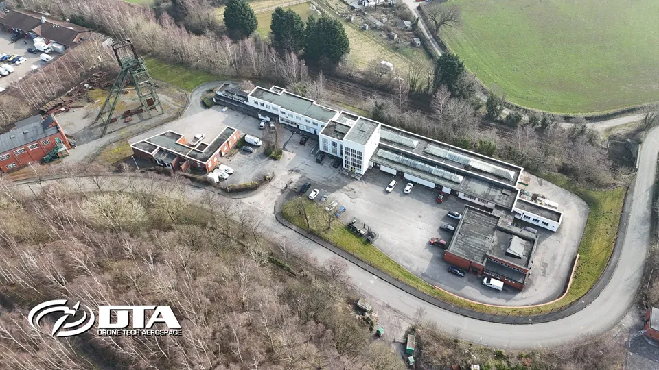 Aerial photograph looking down on an enterprise park with rows of commercial units.