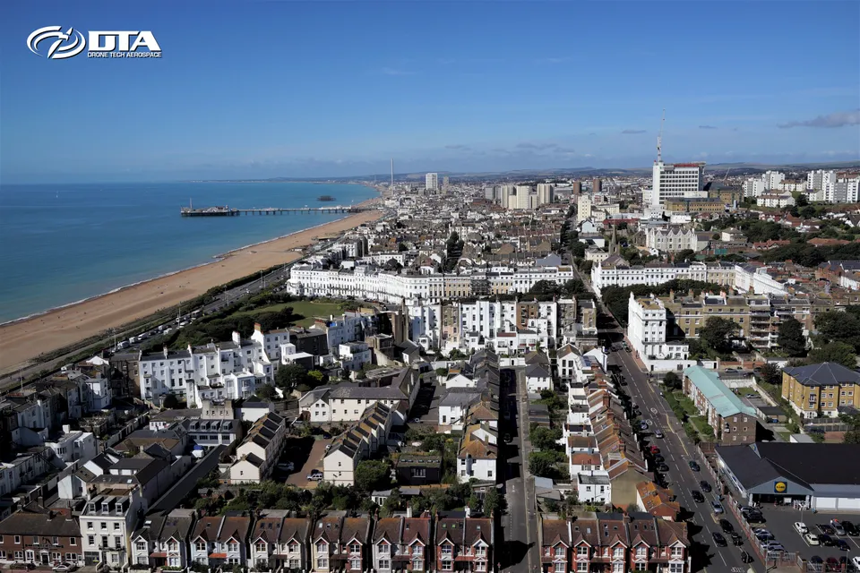 Aerial photograph of the Brighton coastline and seafront buildings captured from a drone.