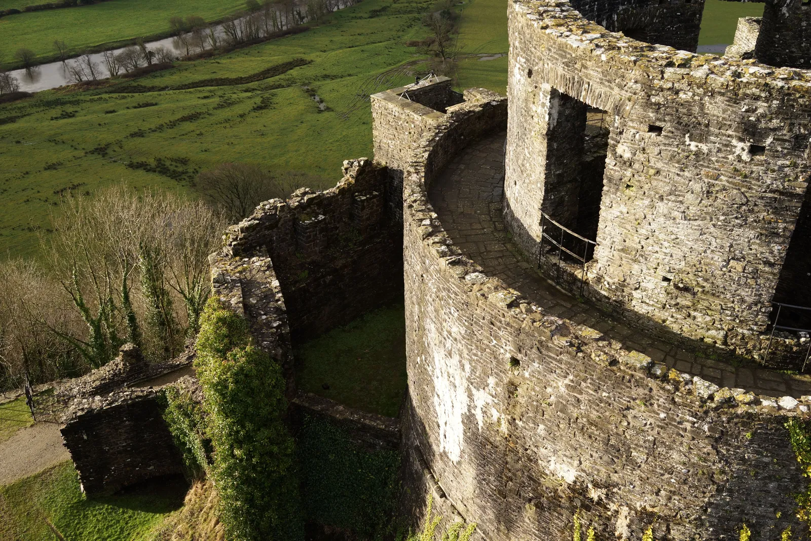 Aerial photograph of parkland, mature trees and a historic estate at Dinefwr.