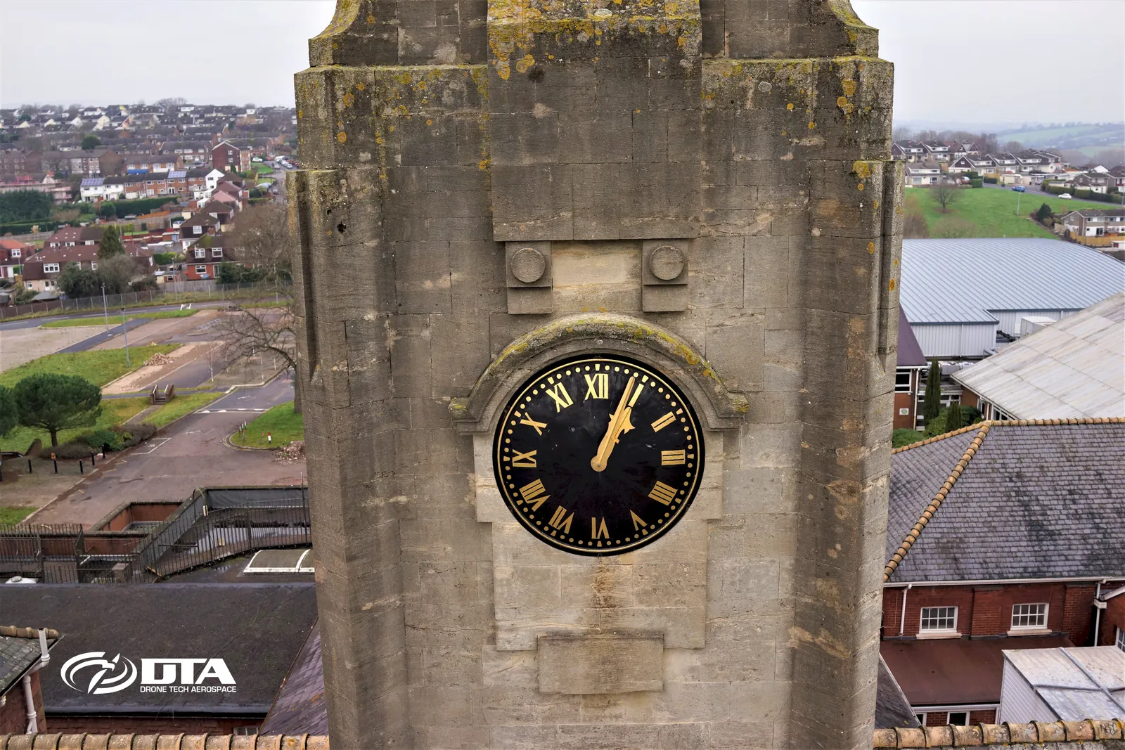 Aerial photograph of a tall structure captured close-up during a drone structural inspection at height.