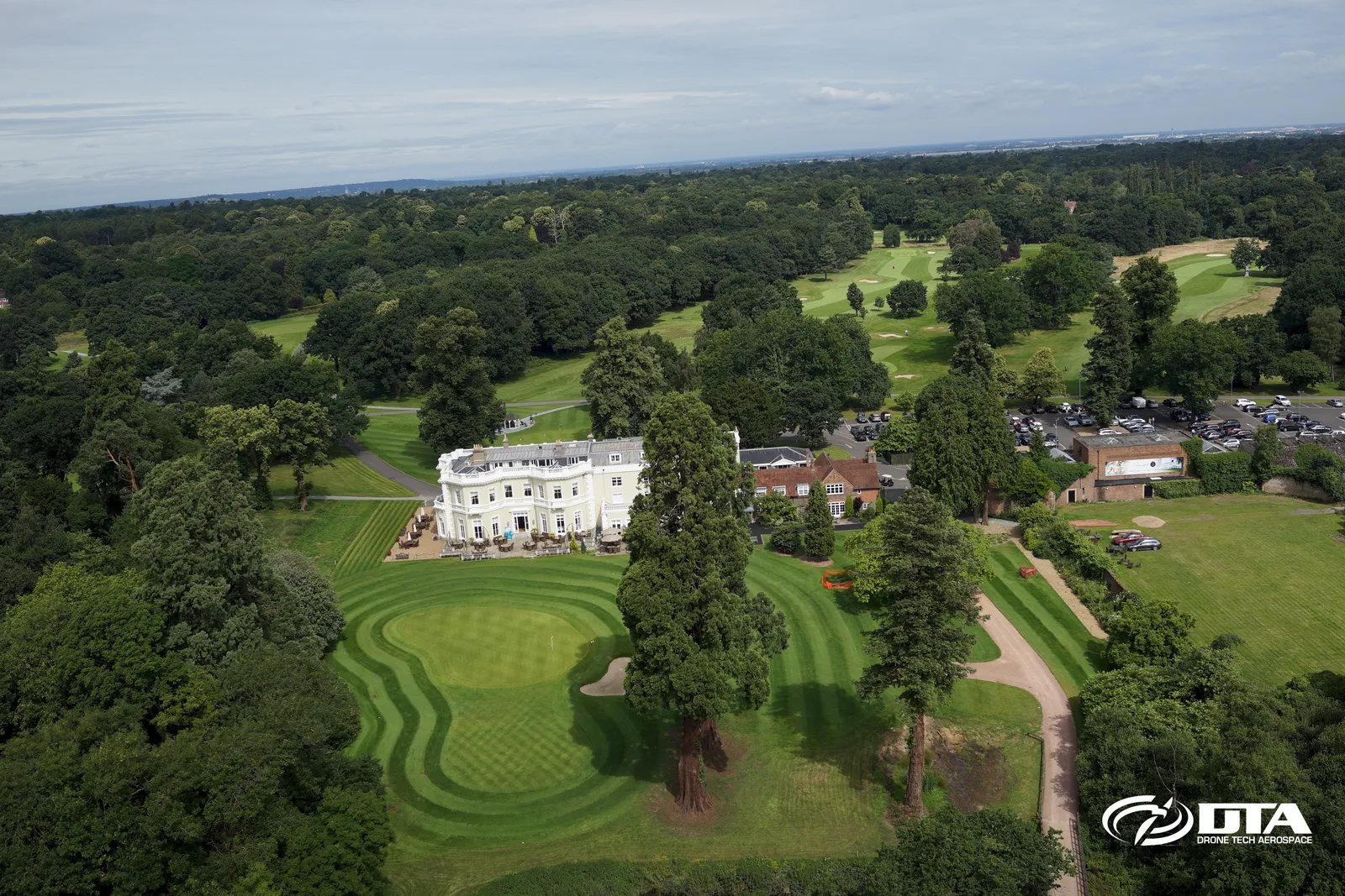Aerial photograph of a golf course fairway and green captured from a drone.