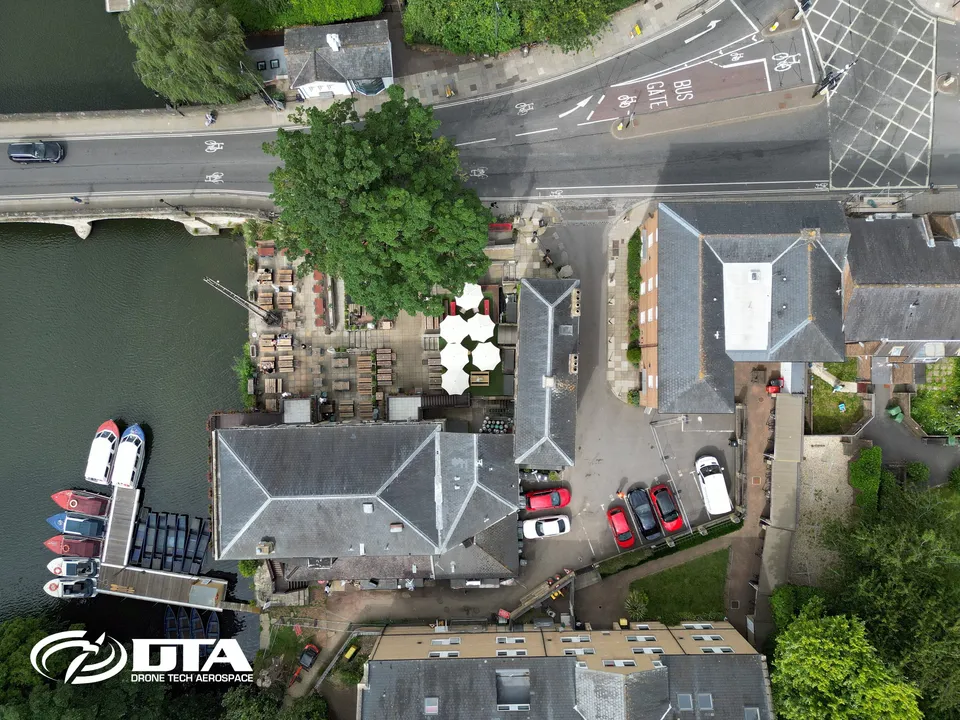 Nadir aerial photograph looking straight down onto the roof of a riverside pub building in Oxford.