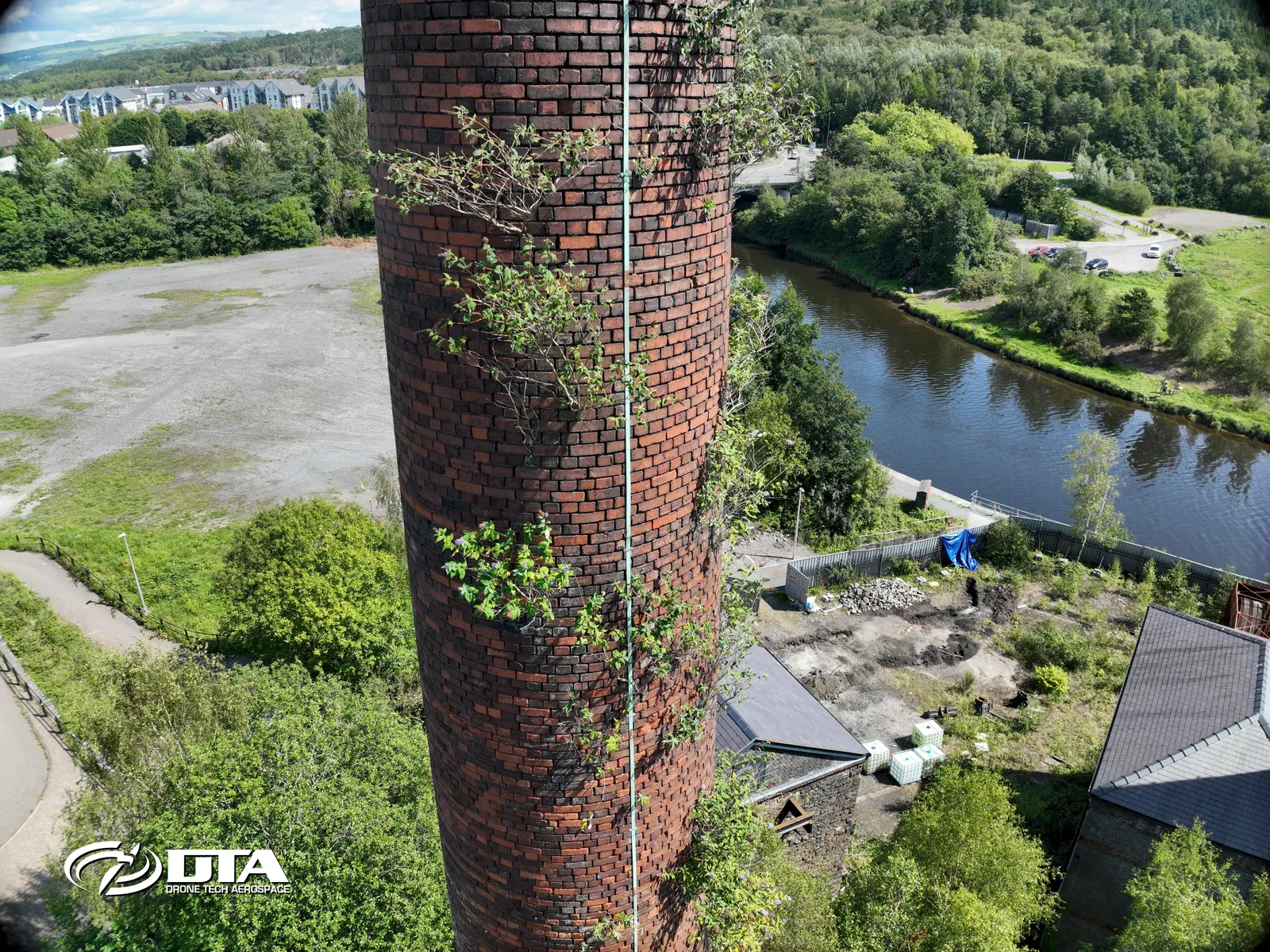 Aerial photograph looking closely at the brick and stack detail of a tall industrial chimney.