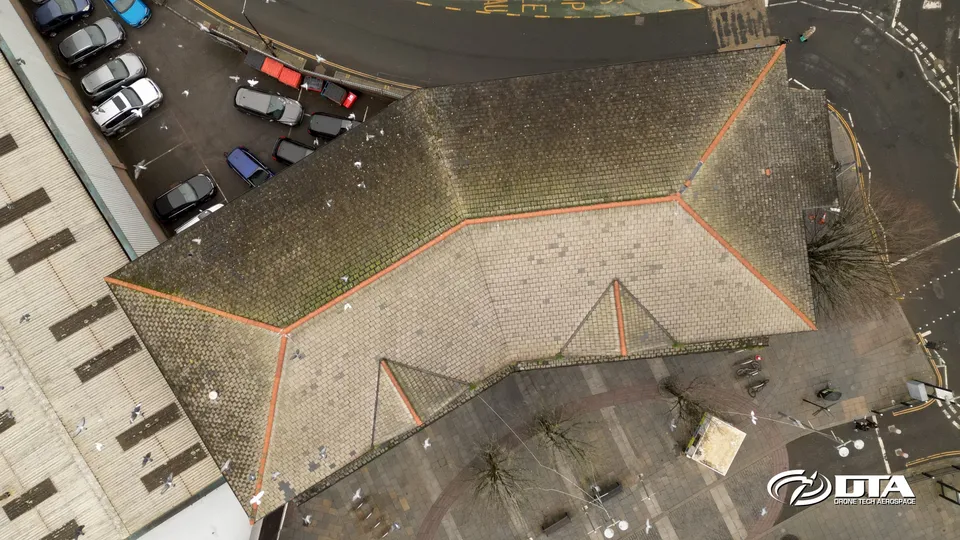 Aerial photograph looking down on the flat roof of a town-centre office building in Bridgend.