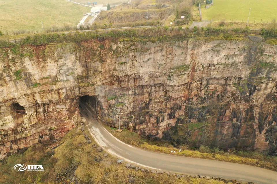 Aerial photograph of a road tunnel entrance and surrounding quarry landscape at Llanddulas.