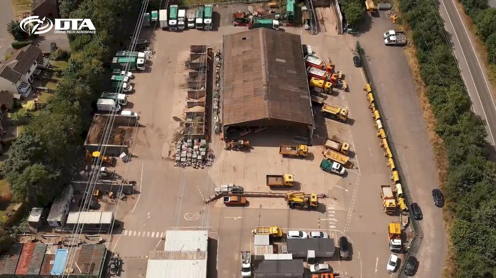 Aerial photograph of a depot yard at Llanfoist with parked vehicles and storage buildings.