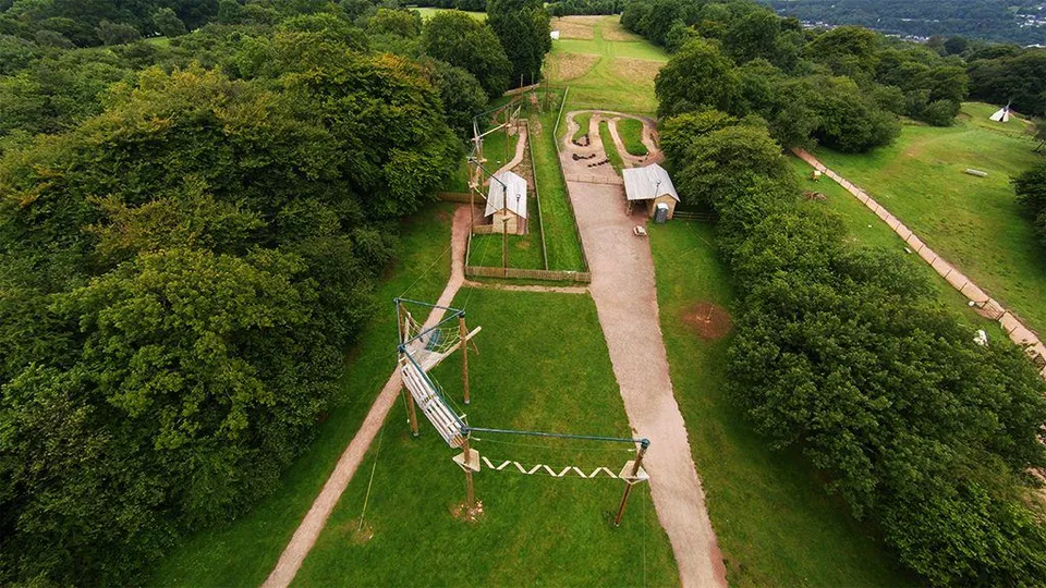 Aerial photograph of a high ropes adventure course among trees at Mountain View Ranch.