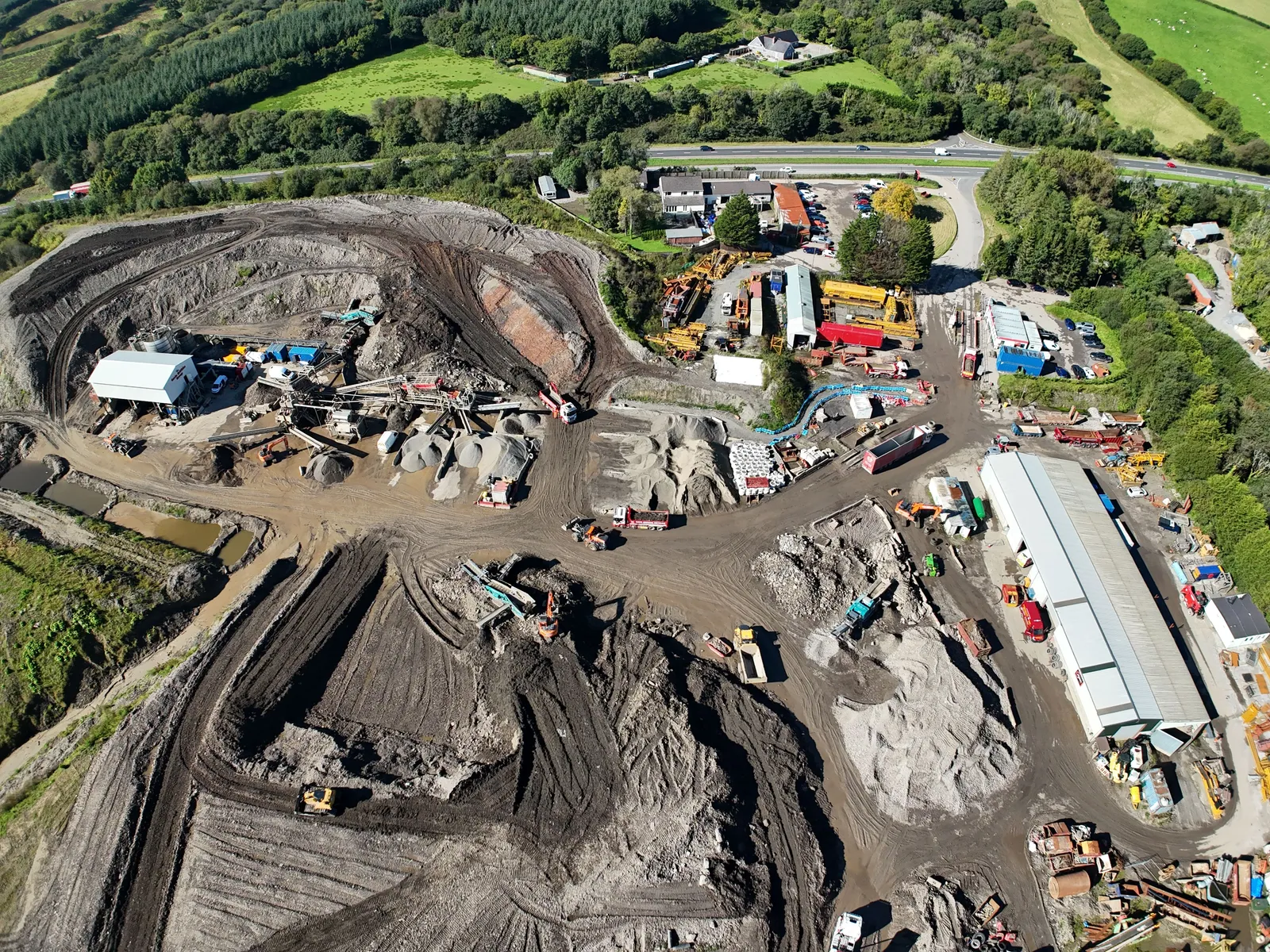 Aerial overview photograph of a farm construction site at Cwmgwili with buildings and access tracks.