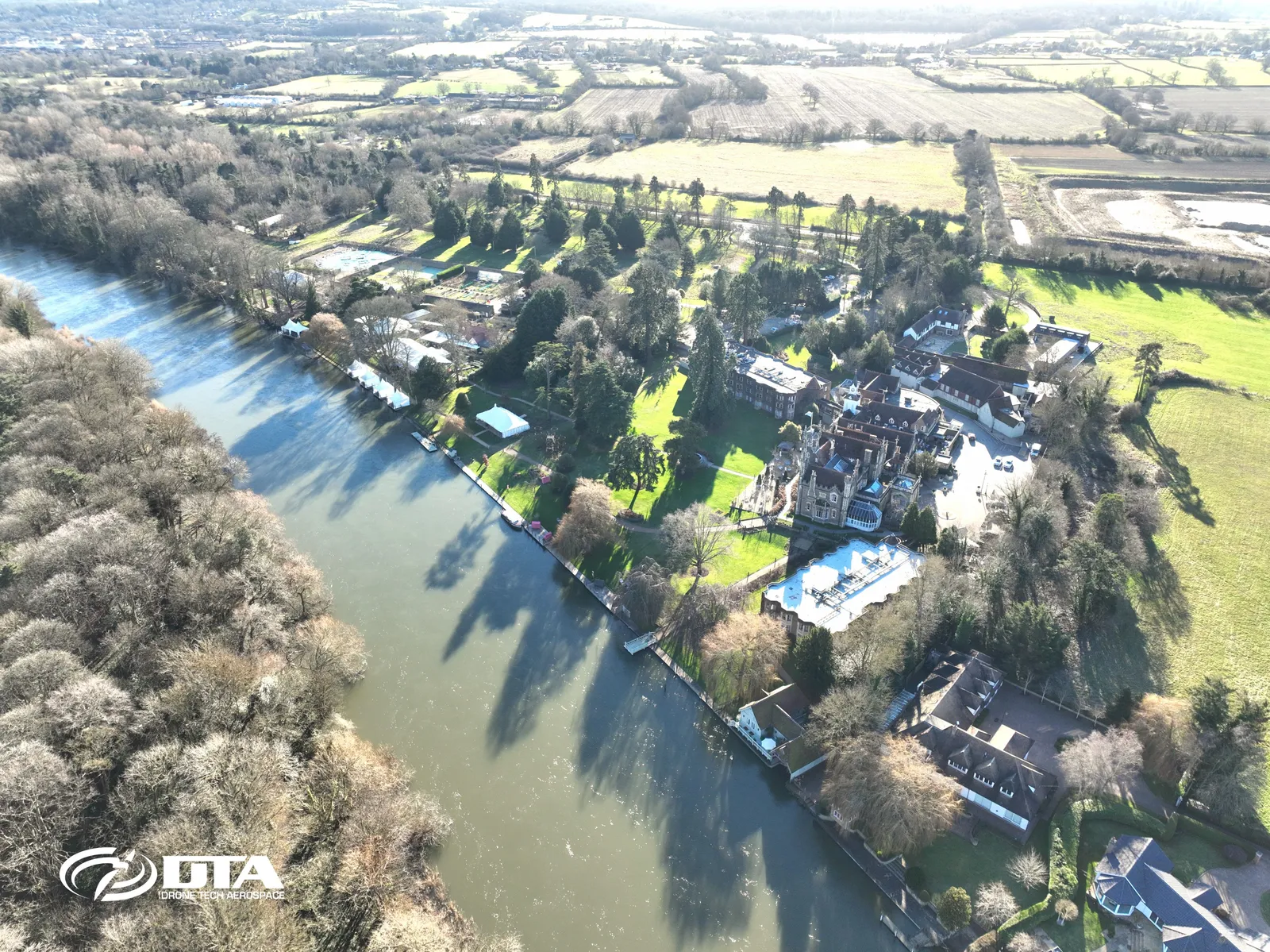 Aerial photograph of a large country house hotel and its grounds beside the road at Windsor.