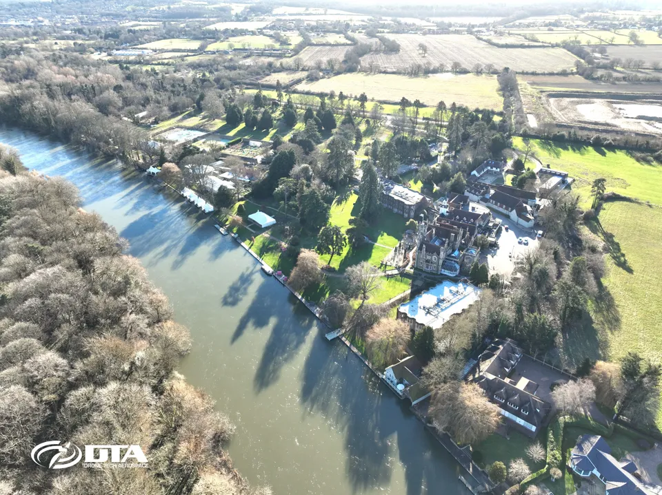 Aerial photograph of a large country house hotel and its grounds beside the road at Windsor.