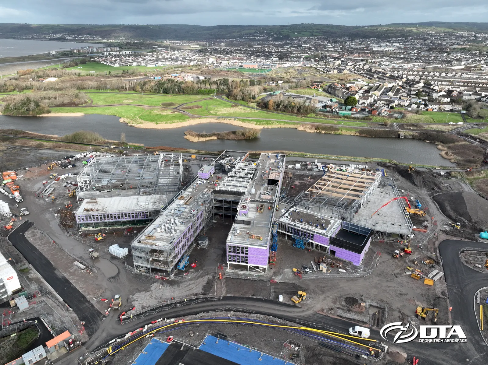 Aerial photograph of a large construction site at Pentre Awel with groundworks and site compounds visible.