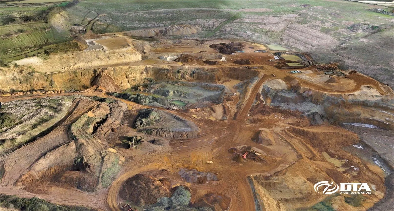 Aerial photograph of a quarry landscape captured for a topographical land survey with terrain contours visible.
