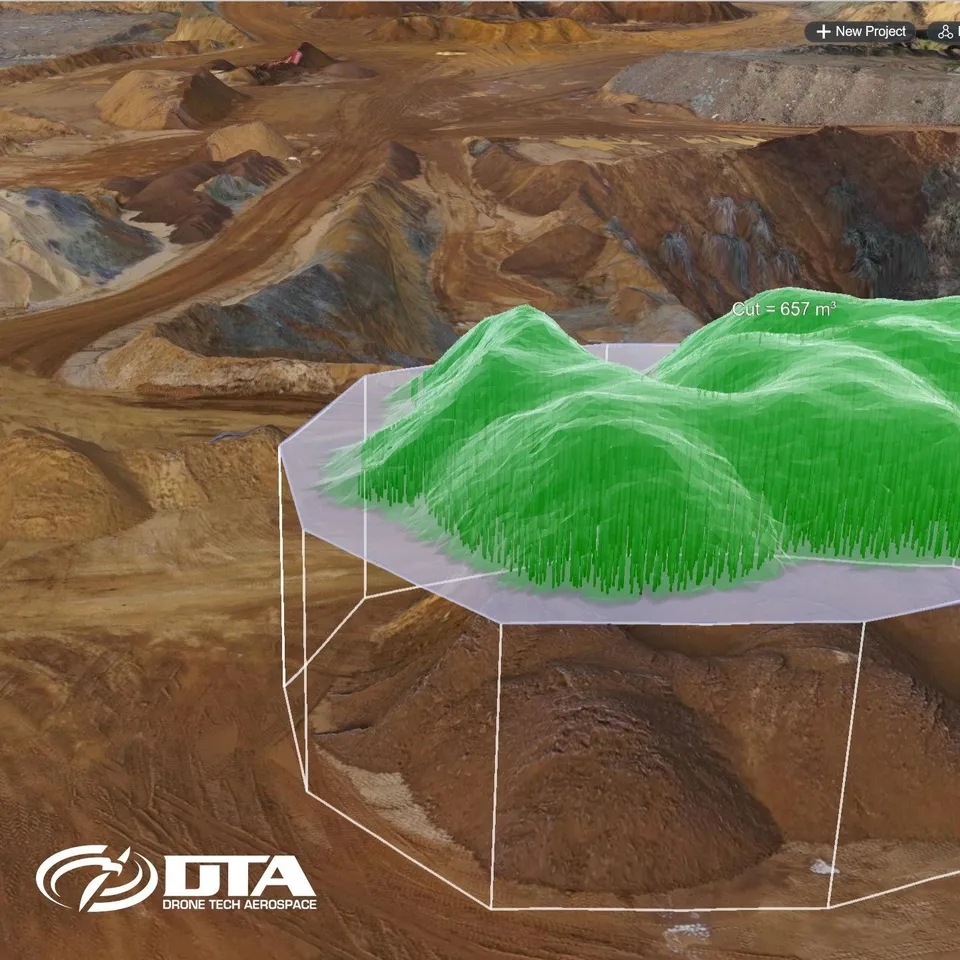 Three-dimensional model of a quarry with a green measurement mesh over a stockpile and a cut volume readout of 657 cubic metres.