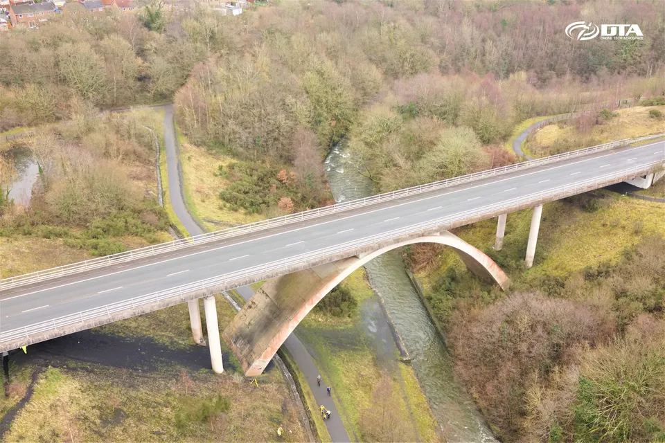 Angled aerial photograph of a stone road bridge crossing a river valley at Rhymney.