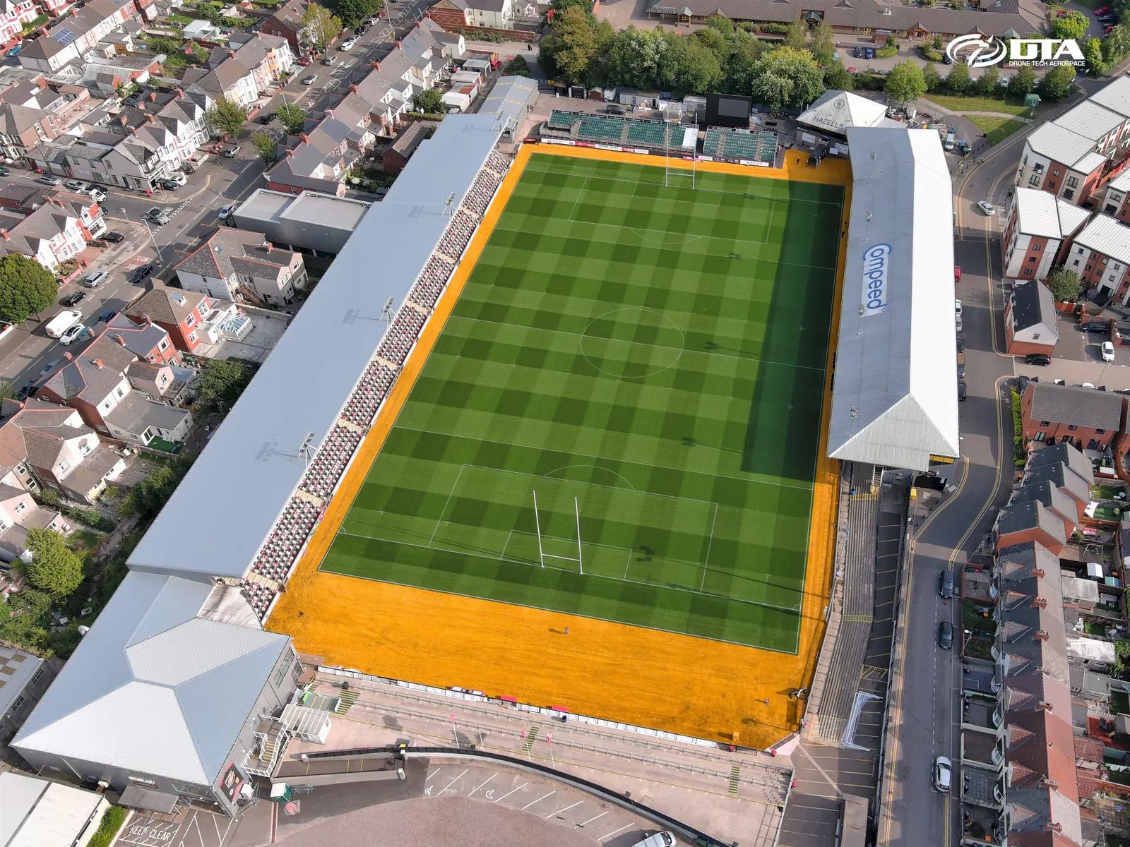 Aerial photograph of a rugby stadium pitch and stands from directly above.