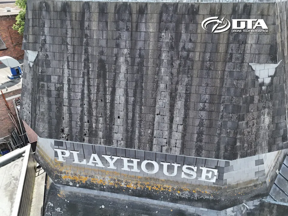 Aerial photograph looking down on a theatre building roof with signage visible at Salisbury Playhouse.