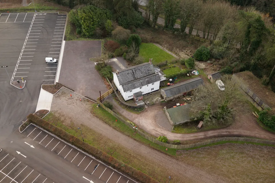 Aerial photograph of traditional Welsh cottages and farm buildings within the St Fagans museum grounds.