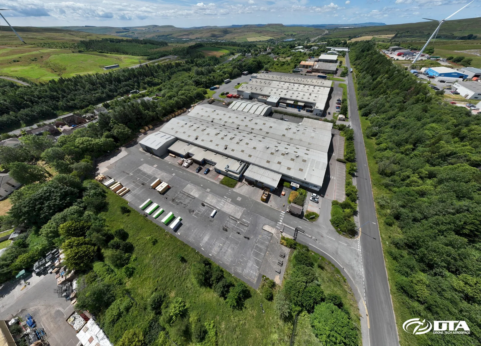Aerial photograph looking down on an industrial unit roof at Tafarnaubach Industrial Estate.