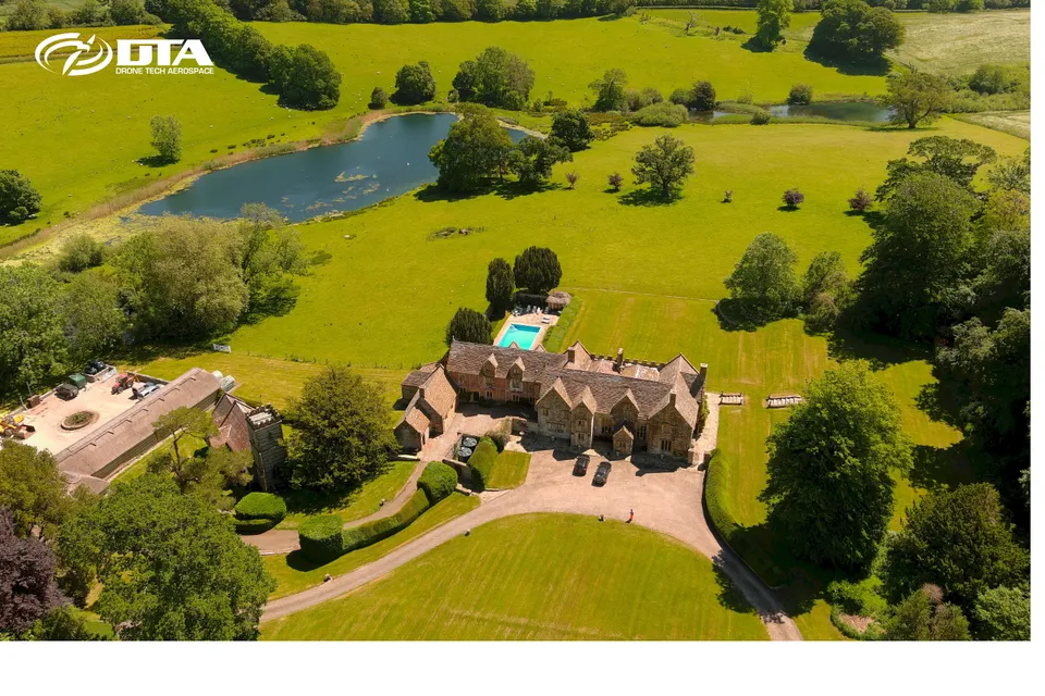 Aerial photograph of a manor house roof and grounds captured for a measured building survey.