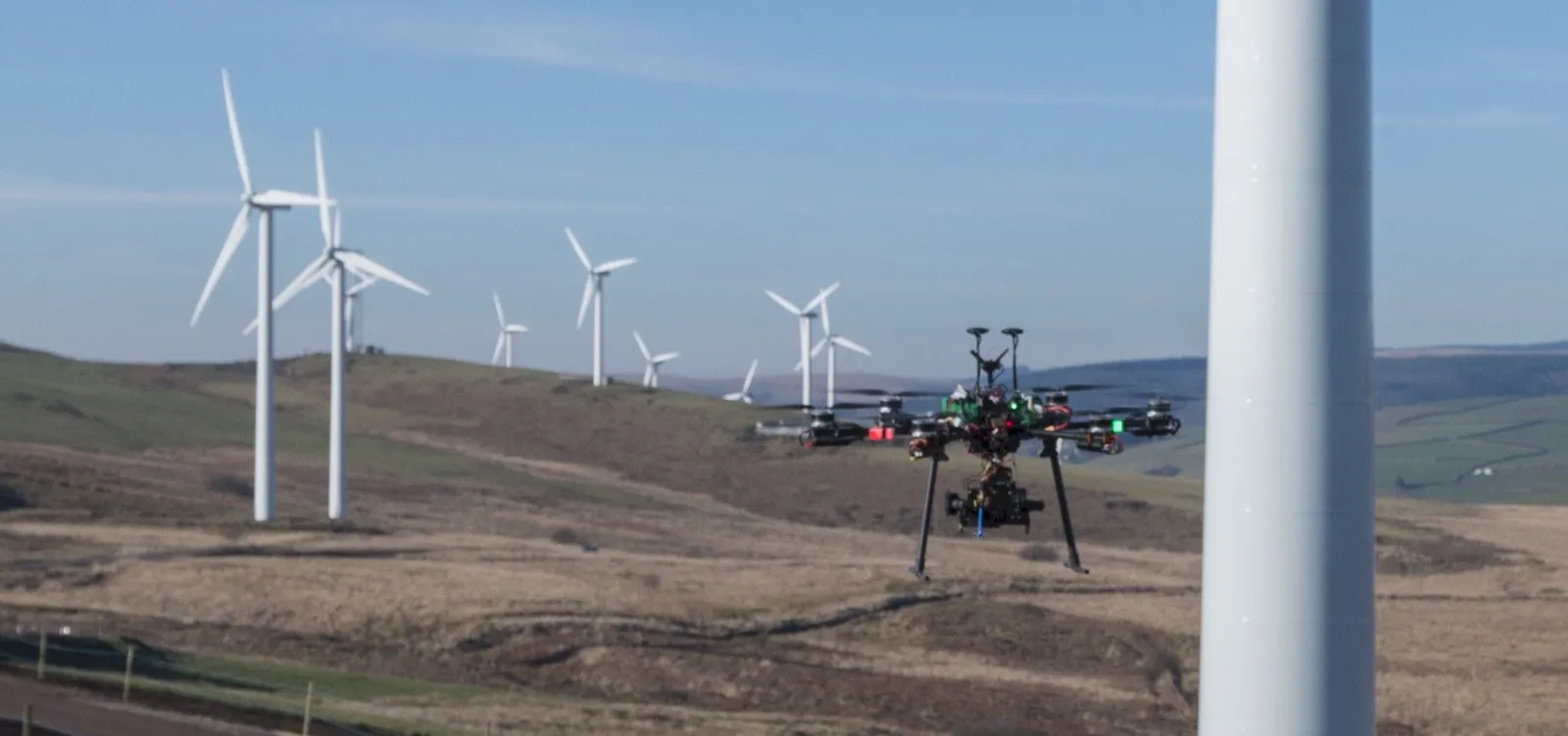 Aerial photograph of wind turbines in a windfarm captured during a combined inspection and survey flight.
