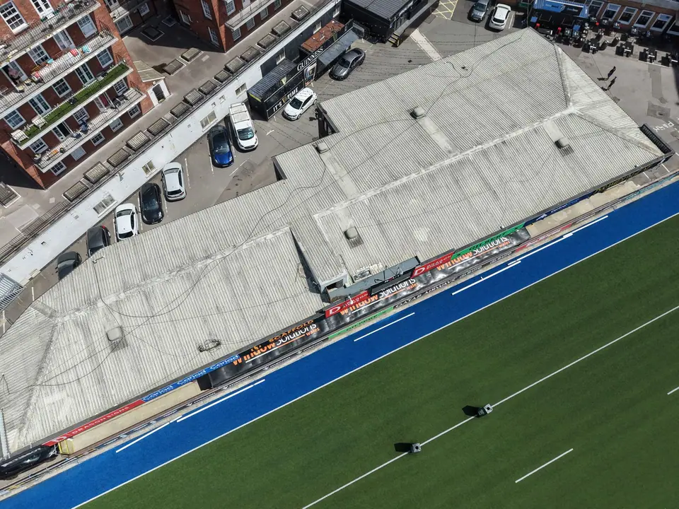 Top-down drone view of a Cardiff Arms Park stand roof beside the pitch
