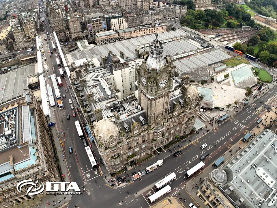 Aerial view of The Balmoral hotel clocktower and roofscape above Princes Street, Edinburgh