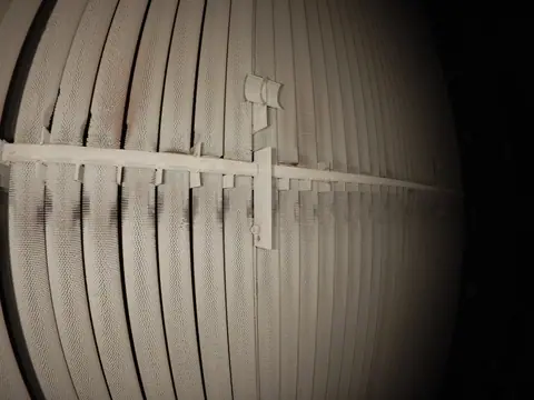 Caged drone flying an internal confined-space inspection inside a gas power station