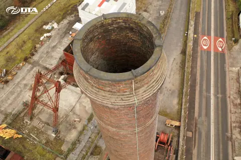 Drone inspection looking down an industrial chimney stack