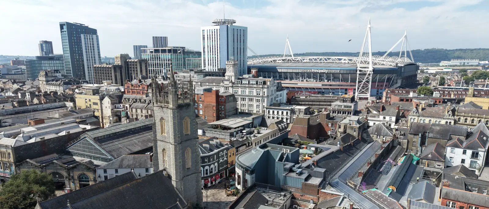 Aerial view over Cardiff city centre with the Principality Stadium and Victorian arcades, captured by DTA